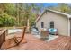 Wooden back deck with an outdoor seating area, a hammock, and peaceful wooded views at 469 Kimberly Ct, Mcdonough, GA 30252