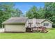 Spacious backyard featuring a well-maintained lawn and large deck for outdoor enjoyment at 469 Kimberly Ct, Mcdonough, GA 30252