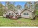Lush green backyard with a wooden deck, perfect for outdoor entertaining and relaxation at 469 Kimberly Ct, Mcdonough, GA 30252