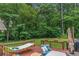 Overlooking backyard with a hammock, grill, and patio seating to enjoy the nature view at 469 Kimberly Ct, Mcdonough, GA 30252