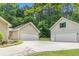 Multiple garage spaces with a large driveway, offering ample parking and storage at 469 Kimberly Ct, Mcdonough, GA 30252