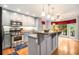 Bright kitchen featuring stainless steel appliances, granite countertops, and center island with view of backyard at 469 Kimberly Ct, Mcdonough, GA 30252