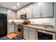 Well-equipped kitchen with stainless steel appliances, granite countertops, under cabinet lighting and stylish cabinets at 469 Kimberly Ct, Mcdonough, GA 30252