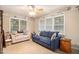 Cozy living room featuring natural light, comfortable seating, and neutral decor at 469 Kimberly Ct, Mcdonough, GA 30252