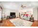 Open-concept living room featuring hardwood floors and comfortable seating at 469 Kimberly Ct, Mcdonough, GA 30252