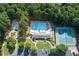 Aerial view of community amenities, including a pool, tennis courts, playground, and clubhouse at 513 Huntgate Rd, Woodstock, GA 30189