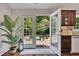 The kitchen features a door leading to the outdoor patio and backyard area, perfect for indoor-outdoor living at 513 Huntgate Rd, Woodstock, GA 30189