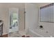 Bright bathroom featuring a shower and jacuzzi tub with neutral decor at 513 Huntgate Rd, Woodstock, GA 30189
