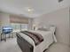 Cozy bedroom with a comfortable bed, window, and a modern television set at 513 Huntgate Rd, Woodstock, GA 30189
