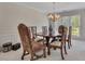 Formal dining area with a traditional table, elegant chairs, and neutral decor at 513 Huntgate Rd, Woodstock, GA 30189