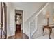 Bright foyer with wood floors, staircase, and entry to the rest of the home at 513 Huntgate Rd, Woodstock, GA 30189