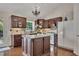 Updated kitchen featuring wood cabinets, granite countertops, tiled backsplash, and hardwood floors at 513 Huntgate Rd, Woodstock, GA 30189