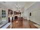 Spacious kitchen with dark wood cabinets, granite countertops, stainless steel appliances, and hardwood floors at 513 Huntgate Rd, Woodstock, GA 30189