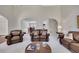 This living room features archways, plush seating, and a cozy atmosphere perfect for relaxation and entertaining guests at 513 Huntgate Rd, Woodstock, GA 30189
