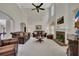 Bright living room with a fireplace, high ceilings, plush seating, and an open layout for relaxed living and entertaining at 513 Huntgate Rd, Woodstock, GA 30189