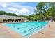 Community swimming pool with plenty of lounge seating, perfect for relaxing in the sun at 513 Huntgate Rd, Woodstock, GA 30189