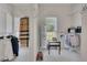 Walk-in closet with organizers, shelves, hanging rods, and carpet floors at 513 Huntgate Rd, Woodstock, GA 30189