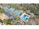 Aerial view of community amenities including tennis courts and a swimming pool at 640 Sibley Se Frst, Marietta, GA 30067
