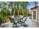 Relax on the back deck with dining and lounge seating, overlooking the serene, wooded backyard at 640 Sibley Se Frst, Marietta, GA 30067