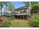 Beautiful backyard featuring a screened porch and a walkout basement with covered patio at 640 Sibley Se Frst, Marietta, GA 30067