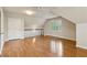 Bright room with hardwood floors, natural light from windows, and a ceiling fan, creating a comfortable and inviting space at 640 Sibley Se Frst, Marietta, GA 30067