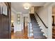 Inviting foyer with hardwood floors, staircase, and neutral decor leading to the rest of the home at 640 Sibley Se Frst, Marietta, GA 30067