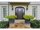 Charming front entrance featuring a stone path, brick facade, and inviting wooden door at 640 Sibley Se Frst, Marietta, GA 30067