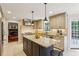 Well-appointed kitchen featuring a large island, stainless steel appliances, and an adjacent living area at 640 Sibley Se Frst, Marietta, GA 30067