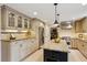 Modern kitchen with granite countertops, stainless steel appliances, and custom cabinetry at 640 Sibley Se Frst, Marietta, GA 30067