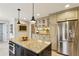 Spacious kitchen with an island, granite countertops, stainless steel appliances, and built-in microwave at 640 Sibley Se Frst, Marietta, GA 30067
