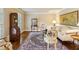 Elegant living room with hardwood floors, decor, neutral colors, and large windows, creating a bright and inviting space at 640 Sibley Se Frst, Marietta, GA 30067