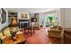 Inviting living room features a cozy fireplace, built-in shelving, and elegant French doors to a sunroom at 640 Sibley Se Frst, Marietta, GA 30067