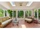 Bright sunroom with skylights and multiple windows offering beautiful views of the surrounding greenery at 640 Sibley Se Frst, Marietta, GA 30067