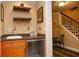 Finished basement bar area with custom shelving and wine cooler at 104 Fairway Overlook, Woodstock, GA 30188