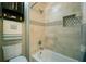 Clean bathroom showcasing a bathtub with tiled walls and a modern shower fixture at 104 Fairway Overlook, Woodstock, GA 30188