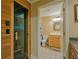 Bright bathroom with wood cabinets and luxurious sauna at 104 Fairway Overlook, Woodstock, GA 30188