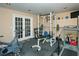 Spacious home gym with modern exercise equipment and rubber floor at 104 Fairway Overlook, Woodstock, GA 30188