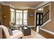Inviting living area with bay window, comfortable seating, and elegant decor near the entry at 104 Fairway Overlook, Woodstock, GA 30188