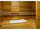 Wood paneled sauna with built in seating and blue accent lights at 104 Fairway Overlook, Woodstock, GA 30188
