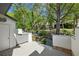 Backyard features a spacious deck, trees, and partial privacy fence at 1294 Fernwood Ne Cir, Brookhaven, GA 30319