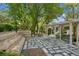 Backyard showing the patio, tiered seating and a pergola at 1294 Fernwood Ne Cir, Brookhaven, GA 30319