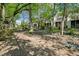 Backyard with mature trees, a small bridge and landscaping at 1294 Fernwood Ne Cir, Brookhaven, GA 30319