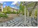 Picturesque backyard with a patio, stone pavers and a pergola at 1294 Fernwood Ne Cir, Brookhaven, GA 30319