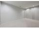 Spacious basement with neutral carpet, white walls and recessed lighting at 1294 Fernwood Ne Cir, Brookhaven, GA 30319