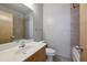 Well-lit bathroom featuring a bathtub with tile surround, neutral paint, and a modern vanity at 1294 Fernwood Ne Cir, Brookhaven, GA 30319