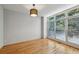Bright and airy bedroom with hardwood floors and large windows offering a serene view of the outside at 1294 Fernwood Ne Cir, Brookhaven, GA 30319