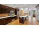 Modern kitchen with stainless steel appliances, hardwood floors and island with breakfast bar at 1294 Fernwood Ne Cir, Brookhaven, GA 30319