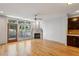 Living room with fireplace, hardwood floors, large windows with lots of natural light at 1294 Fernwood Ne Cir, Brookhaven, GA 30319