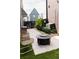 Cozy backyard patio area with stylish chairs, a modern fire pit, and lush landscaping at 135 Channing Ln, Fayetteville, GA 30214