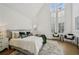 Bright bedroom with tall ceilings, large windows and stylish decor at 135 Channing Ln, Fayetteville, GA 30214